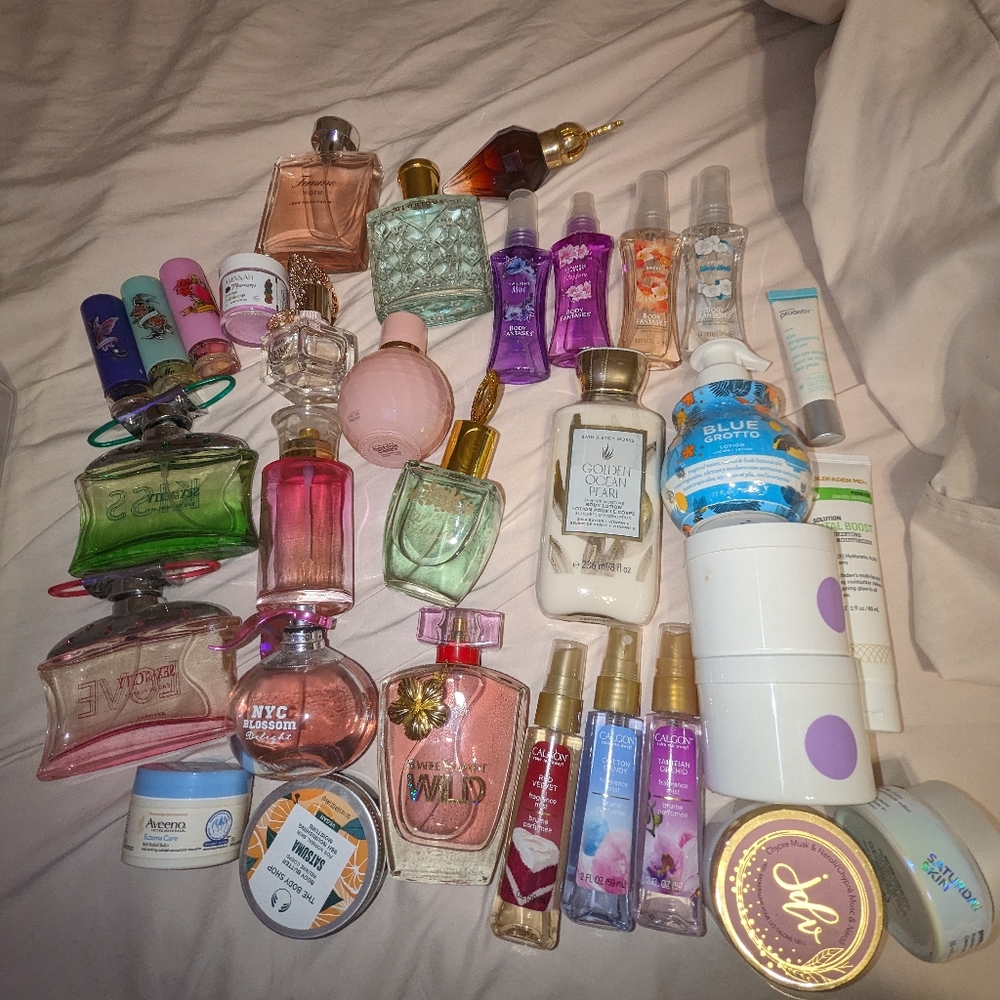 Twenty bottle of perfume with bonus lotions lip scrub